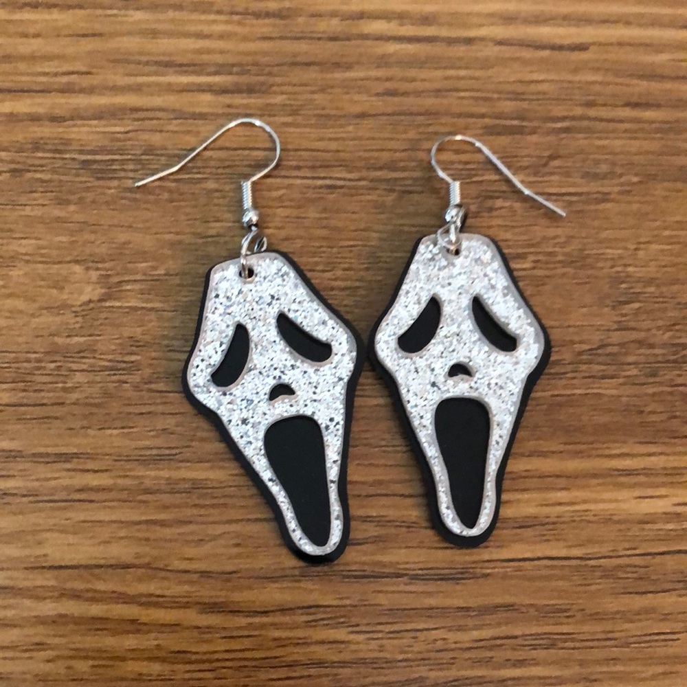 Ghost face earrings.
